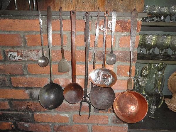 fine assortment of hand wrought iron cooking utensils (some signed)