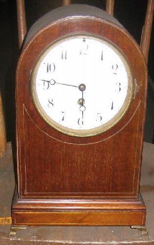 shelf clock with string inlay and brass bracket feet