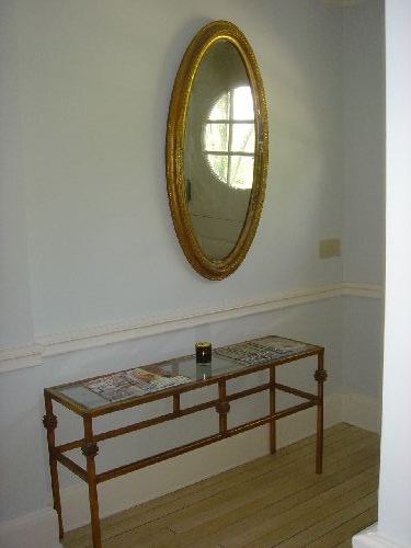 gilt metal and beveled glass console table