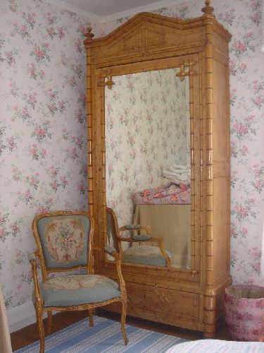 English walnut faux bamboo wardrobe with beveled glass mirror door