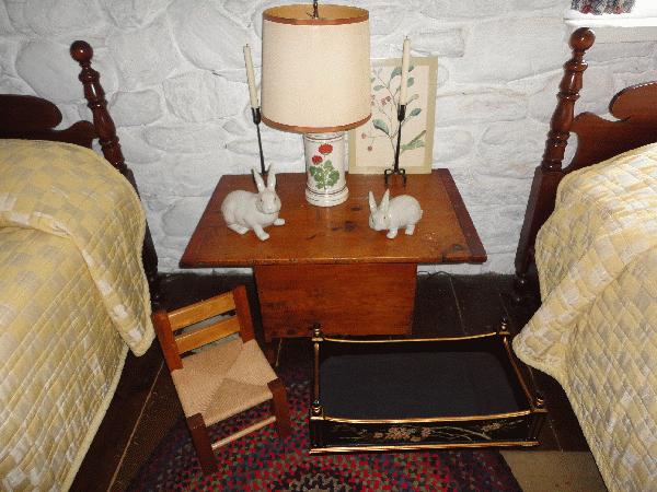 diminutive hutch table, child's chair, dog bed